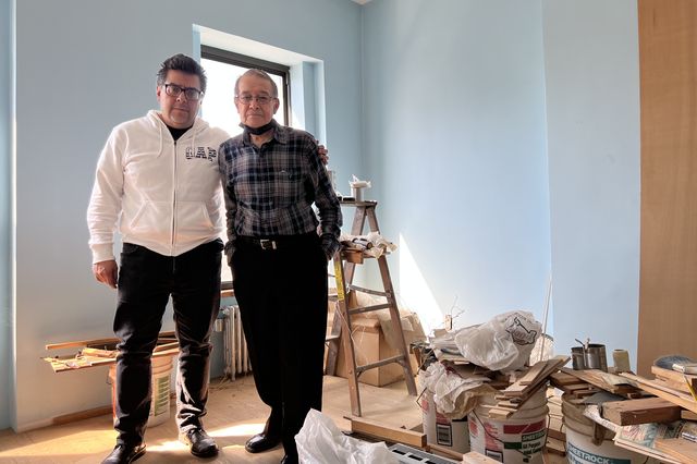 Ray Cortez (right) with his son, Ray Cortez Jr. (left), inside the Brooklyn brownstone he bought in 1969.